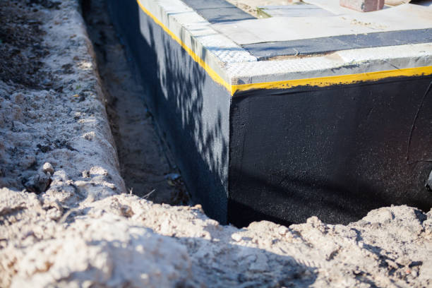 Professional Waterproofing technician working in Oxon Hill, MD